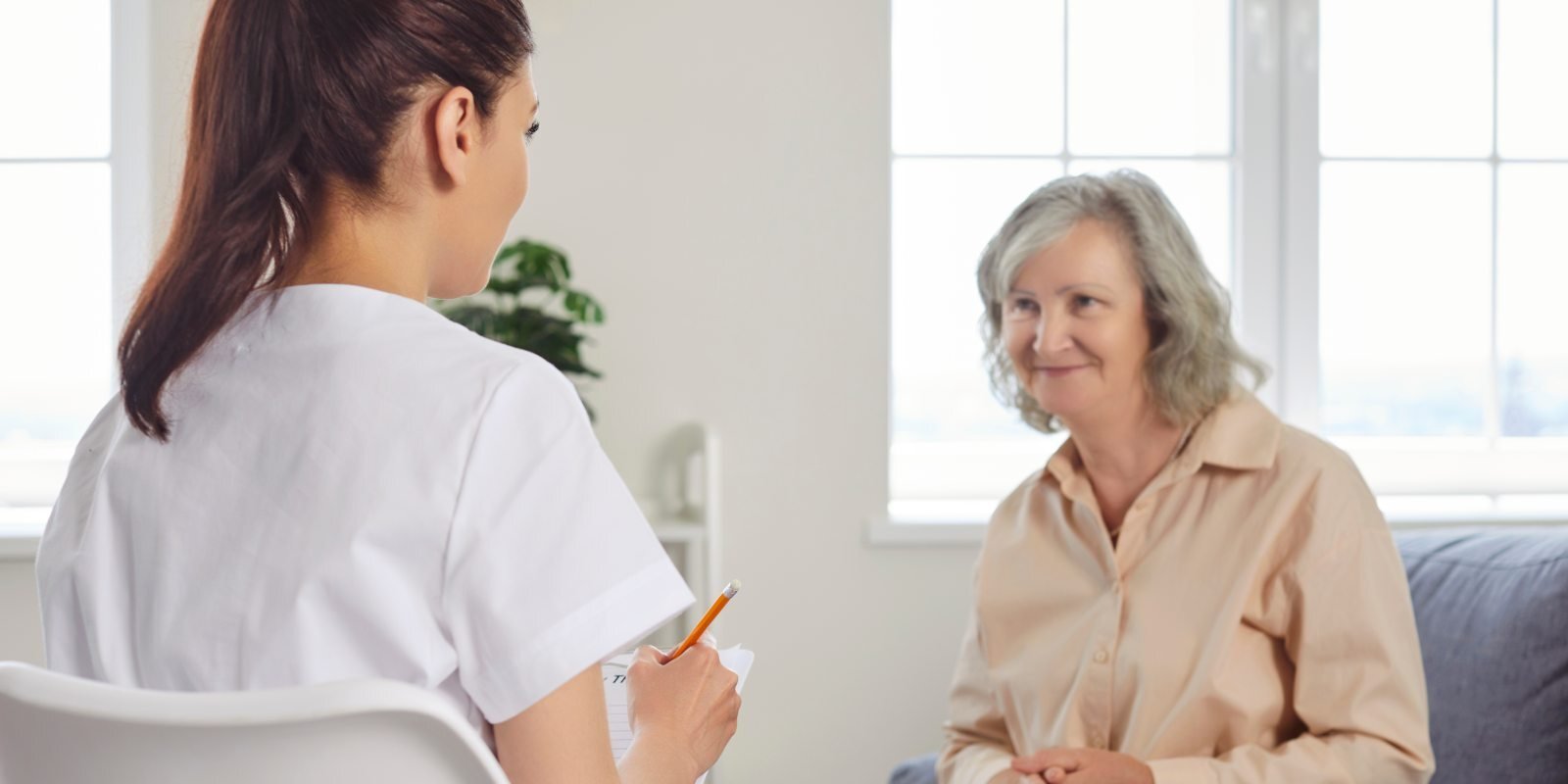 Elderly Resident of an ALF meeting with staff
