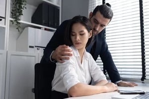 boss touching employee in wrong manner