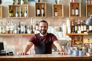 happy man, barman or waiter at bar
