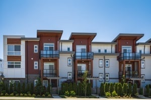large set of condos against a blue sky