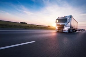 loaded european truck on motorway in sunset