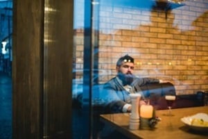 man sitting in the bar