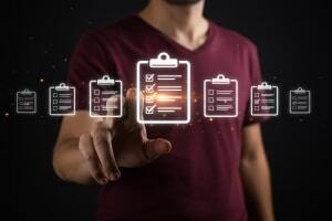 Person Touching Commercial Insurance Checklist on A Digital Screen