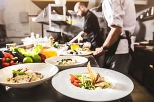 professional chef cooking in the kitchen restaurant at the hotel