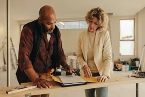 professional contractor and homeowner signing an agreement for renovation project