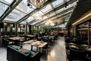 view of stylish empty cafe with arranged tables and chairs for visitors